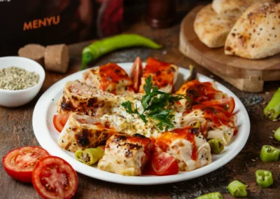 Lavash rolls with stuffings and tomatoes.
